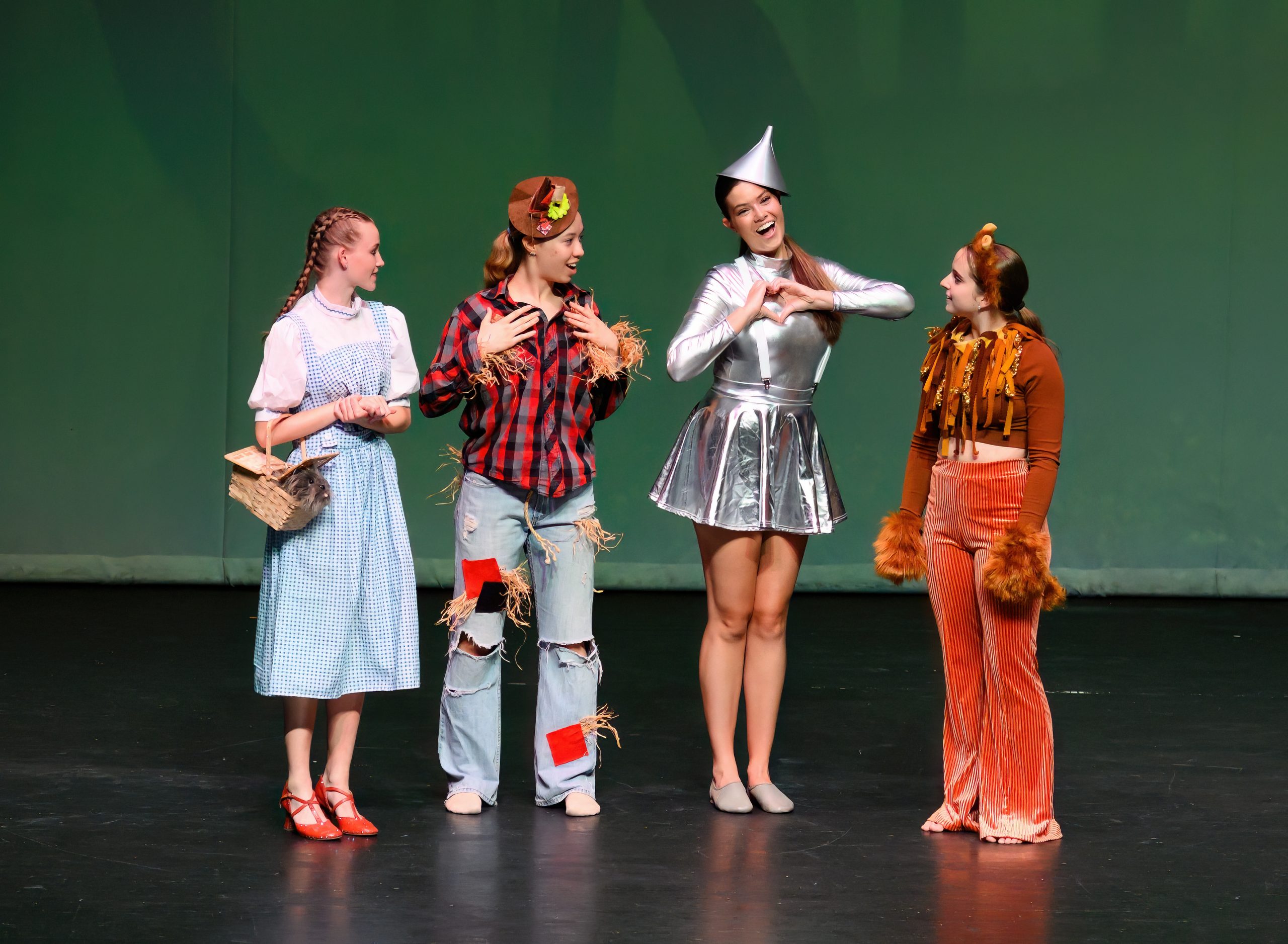 Dorothy, the Scarecrow, the Tin Man and the Cowardly Lion on stage at the recital